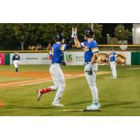 Biloxi Shuckers' Cooper Pratt congratulated by teammate