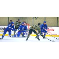 Wheeling Nailers' Jordan Martel battles Trois-Rivières Lions' Logan Nijhoff, Jacob Paquette, and Cory Thomas