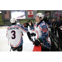 Tucson Roadrunners defenseman Peter DiLiberatore receives high fives