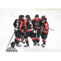 Rapid City Rush gather following a goal