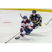 Saginaw Spirit's Calem Mangone and Erie Otters' Pano Fimis on the ice