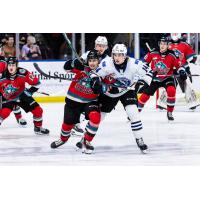 Wenatchee Wild's Dawson Seitz battles the Kelowna Rockets